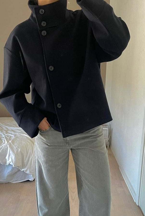 Lumina Wear Martha structured high-neck cropped jacket with button closure, stylish and modern jacket design.