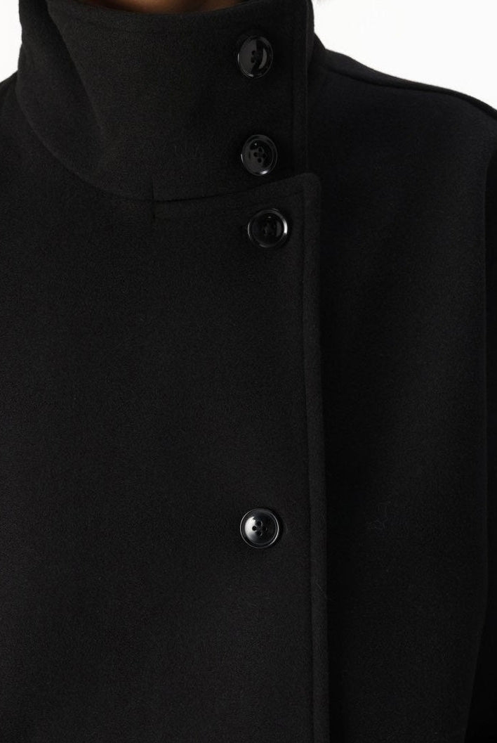 Lumina Wear Martha structured high-neck cropped jacket with button closure, showcasing a tailored fit and modern design.