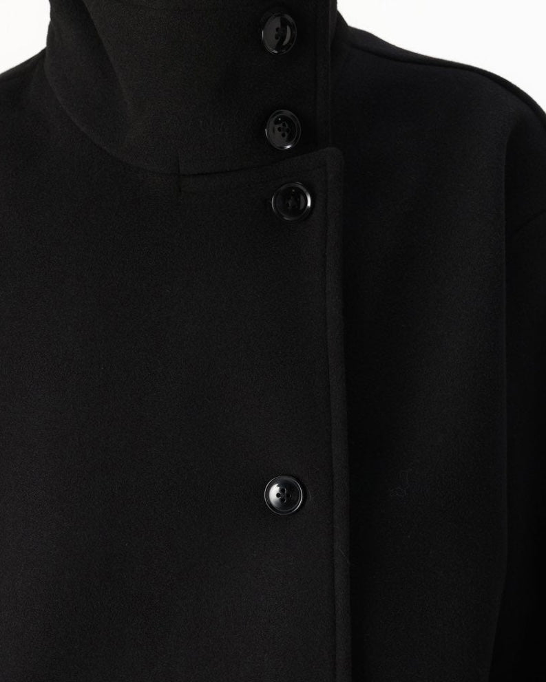 Lumina Wear Martha high-neck cropped jacket with structured design and button closure, showcasing a stylish, modern jacket silhouette.