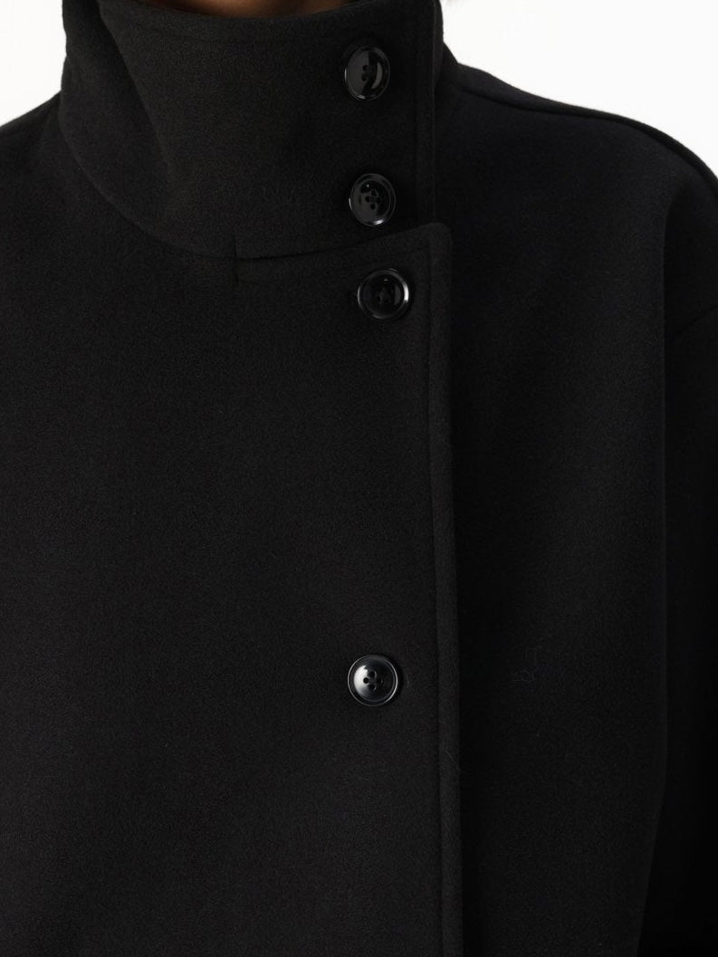 Lumina Wear Martha structured high-neck cropped jacket with button closure, showcasing a tailored fit and modern design.