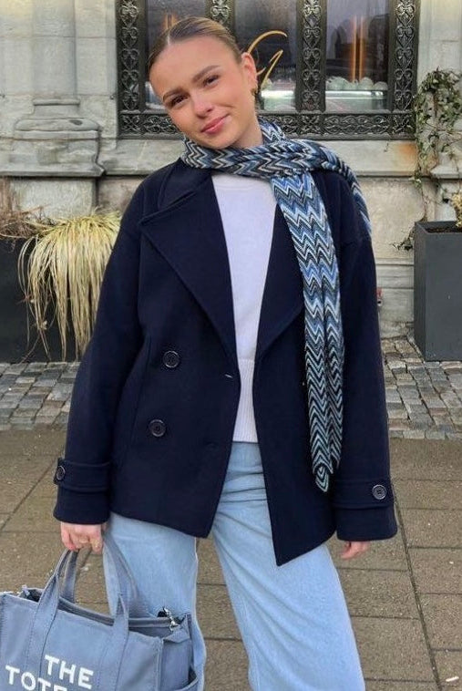Maya Lumina cropped double-breasted trench coat with structured shoulders, stylish and tailored for a sophisticated look.