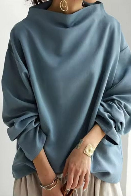 Women’s Lumina Wear Rachel high-neck top with long sleeves, elegant design, and fitted silhouette.