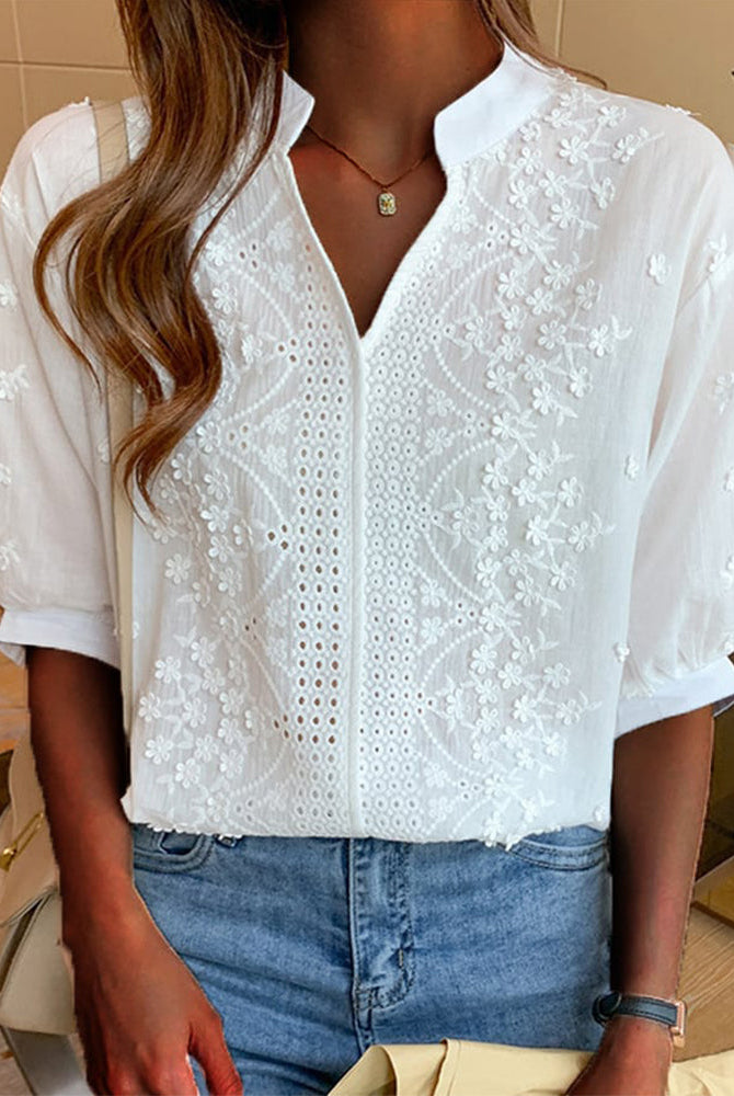 Lumina Wear Serena women's blouse with elegant puff sleeves and a V neckline, showcased on a model.