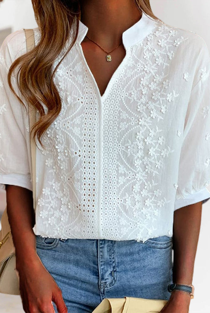 Serena Lumina women's blouse with puff sleeves and V neckline, featuring a stylish and elegant design, shown on a model.