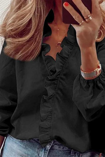 Lumina Wear Serena elegant blouse with ruffle details and V-neck, featuring stylish and feminine design.