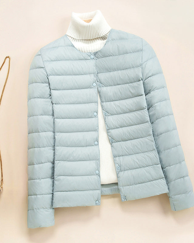 Lumina Wear Serena lightweight quilted puffer jacket with snap button closure, showcasing its stylish design and cozy fit.