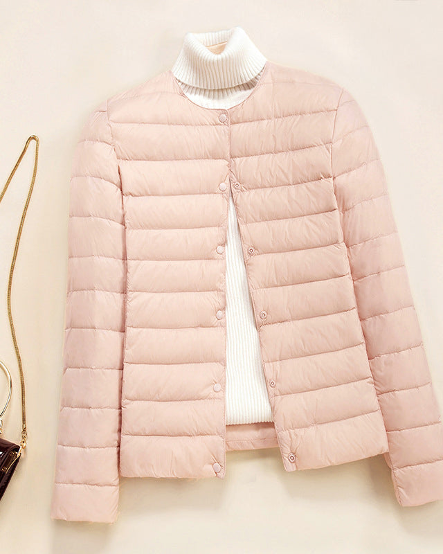 Lightweight quilted puffer jacket by Lumina Wear featuring snap button closure and stylish design.