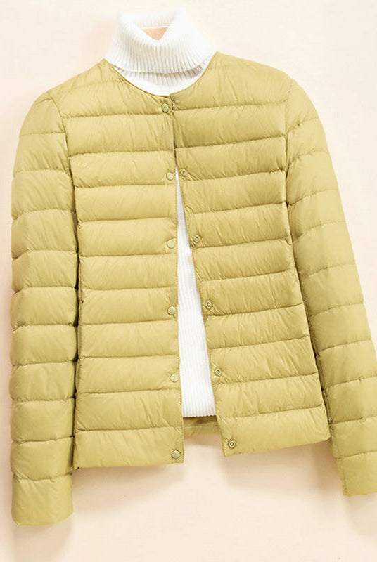 Lightweight quilted puffer jacket with snap button closure from Lumina Wear's Serena down jacket collection.