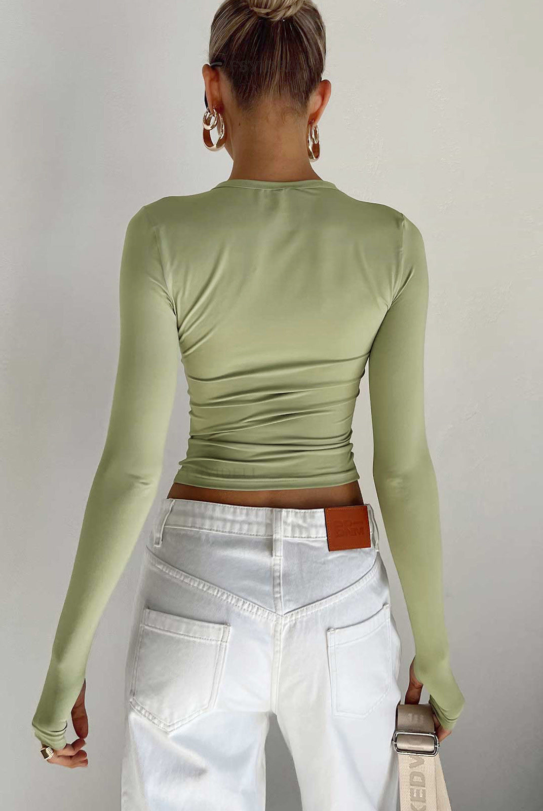 Lumina Wear Serena sleek modern crop top with versatile styling, shown in a close-up of the stylish, fitted design.