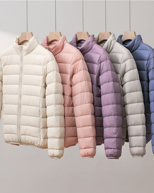Lumina Wear Silva pastel lightweight insulated jacket with high collar, perfect for cold weather and outdoor activities.