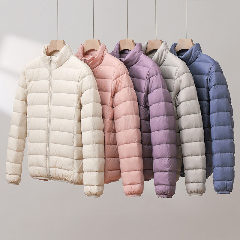 Lightweight pastel insulated Silva Lumina Wear high collar jacket with warmth and style, ideal for cold weather outdoor wear.