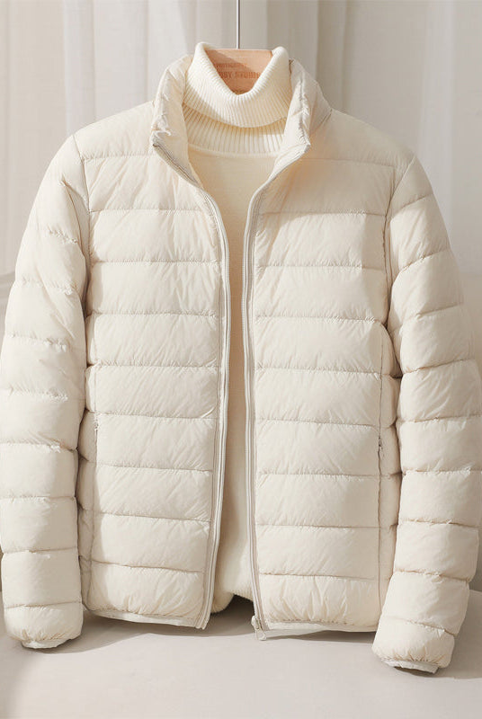Lumina Wear Silva pastel lightweight insulated jacket with a high collar, perfect for cold weather and stylish outdoor wear.
