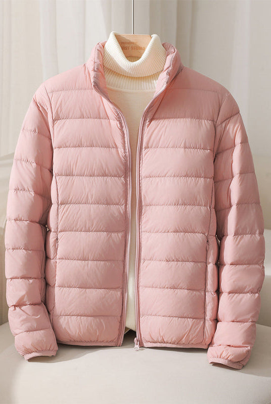 Lumina Wear Silva pastel lightweight insulated jacket with high collar, designed for warmth and comfort.