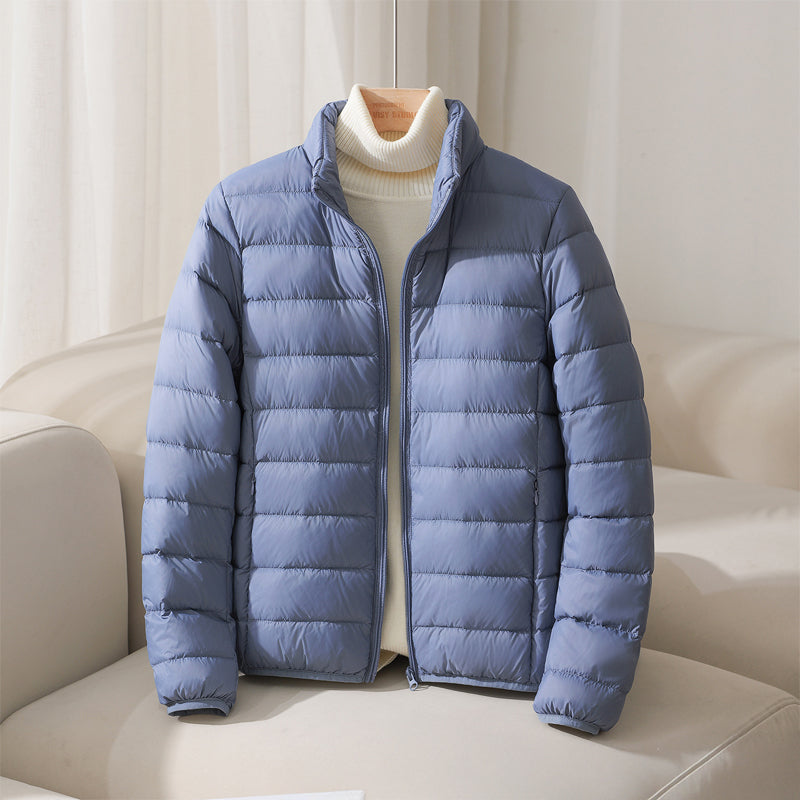 Lightweight pastel insulated Silva Lumina jacket with high collar and zipper, ideal for cold weather outdoor wear.
