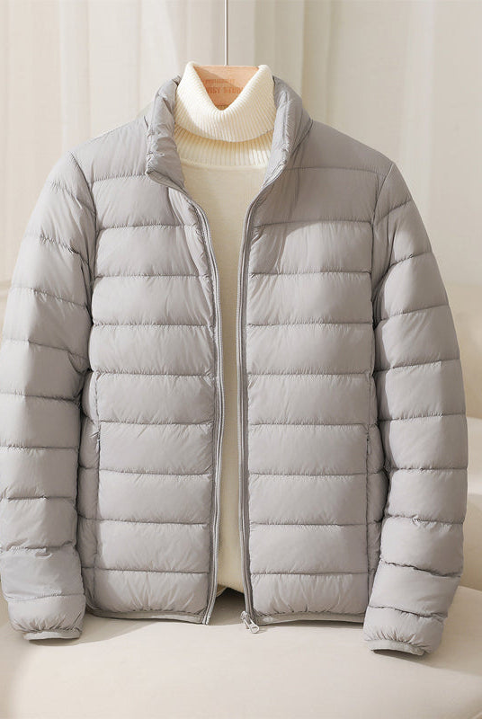 Silva Lumina pastel lightweight insulated high collar jacket featuring a cozy high collar and sleek design for outdoor wear.