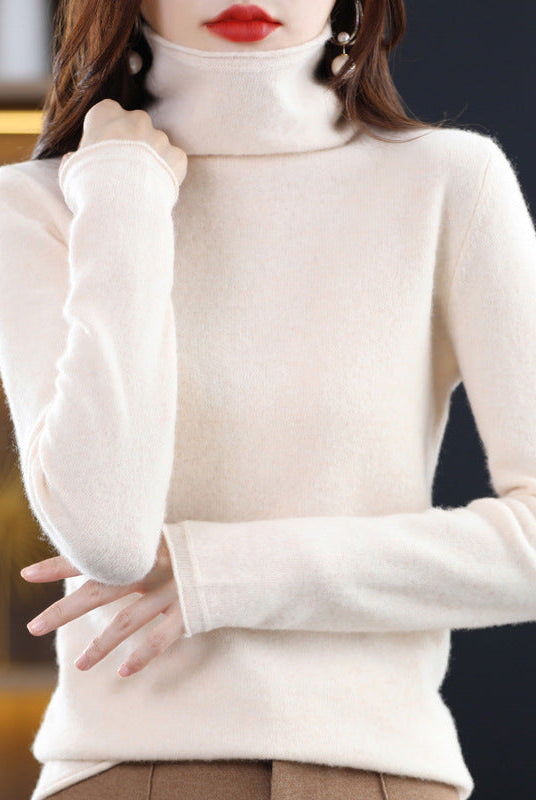 Light gray Sofia Lumina Wear loose-fit sweater with stacked collar and long sleeves, displayed on a hanger.