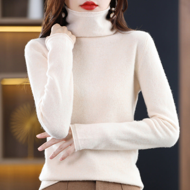 Light gray Sofia Lumina Wear cozy loose-fit sweater with a stacked collar, worn by a woman standing outdoors.