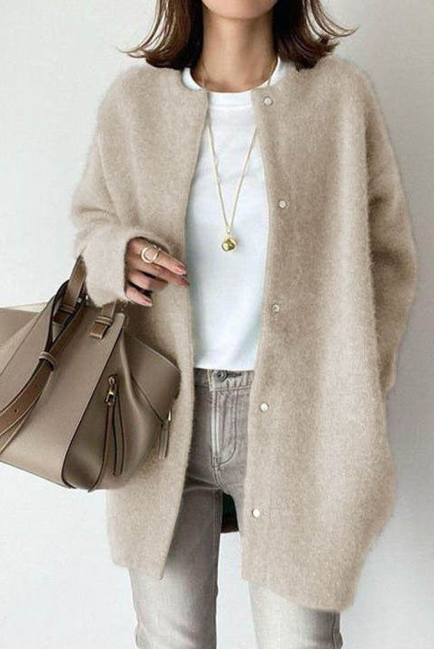 Lumina Wear Sofia cozy relaxed fit wool cardigan with suede accents, shown on a model, featuring a soft knit texture and stylish design.