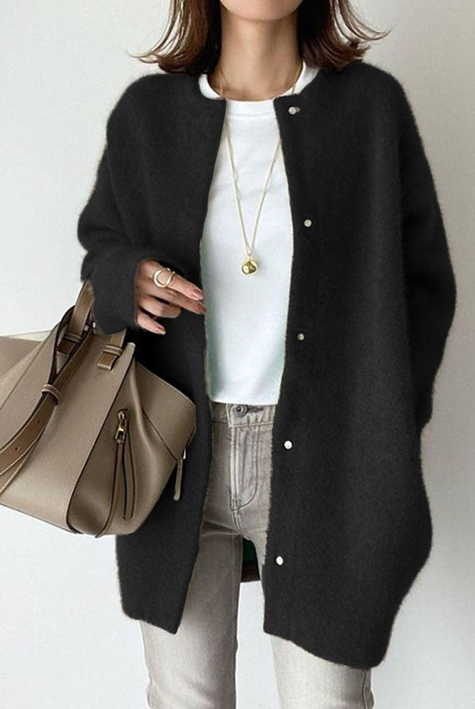 Lumina Wear Sofia cozy relaxed fit wool cardigan with suede accents, shown in a soft, neutral color, displayed on a hanger.