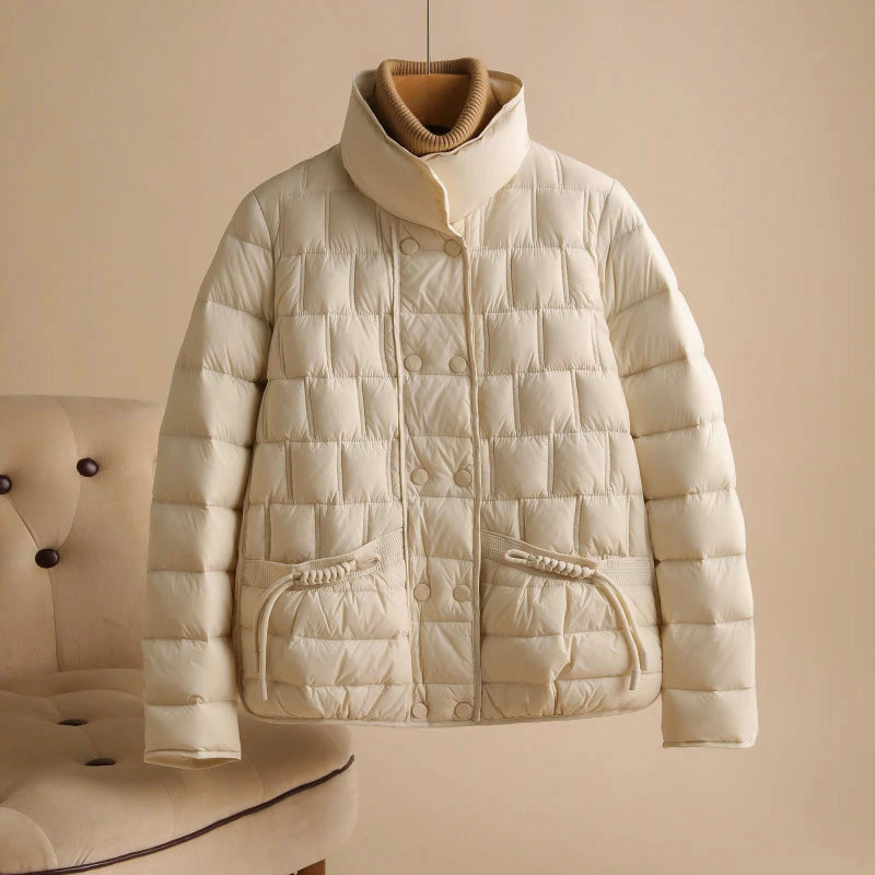 Elegant Lumina Wear Sofia double-breasted insulated women's jacket in broadcloth, shown with a stylish collar and quilted design.