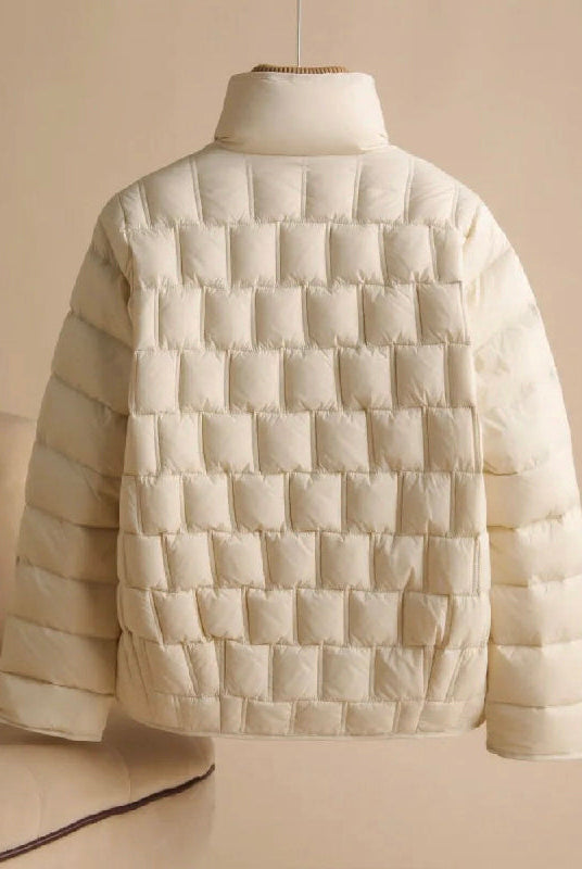 Elegant double-breasted insulated women's jacket in broadcloth from Lumina Wear, shown in a stylish, fitted design.