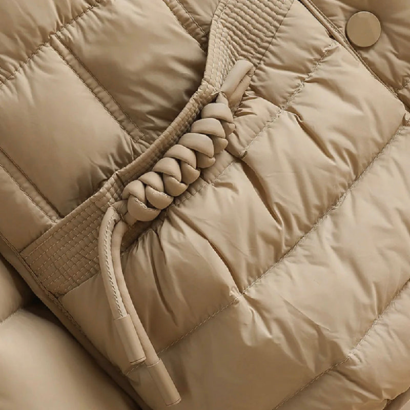 Elegant Lumina Wear Sofia double-breasted insulated women's jacket in broadcloth, showcasing its stylish design and warm insulation.