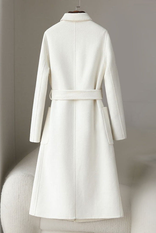 Elegant monochrome wool coat with waist belt, women's fashion by Lumina Wear, featuring a tailored fit and sophisticated style.