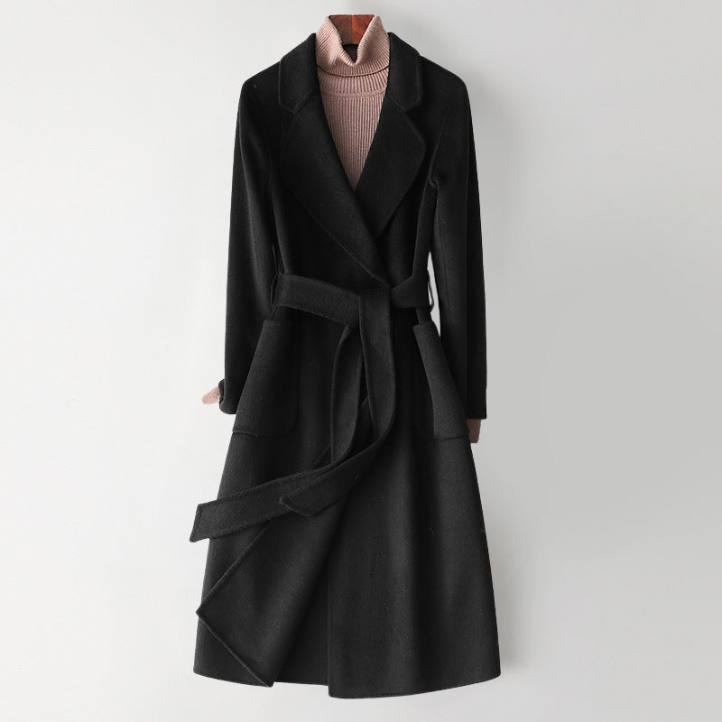 Elegant monochrome wool coat with waist belt for women, by Lumina Wear, featuring a tailored fit and classic style.