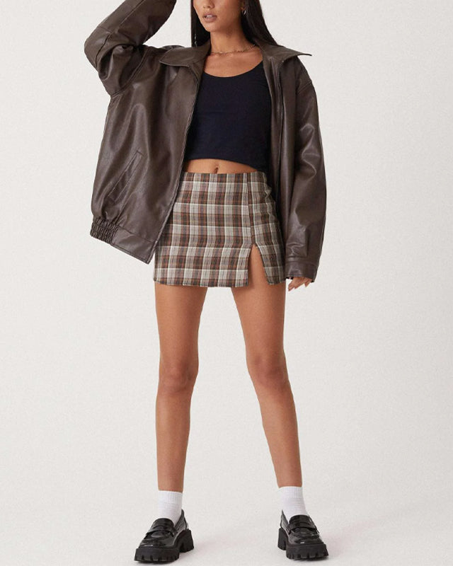 Lumina Wear Sofia oversized relaxed fit faux leather bomber jacket displayed on a model, showcasing its stylish design and texture.