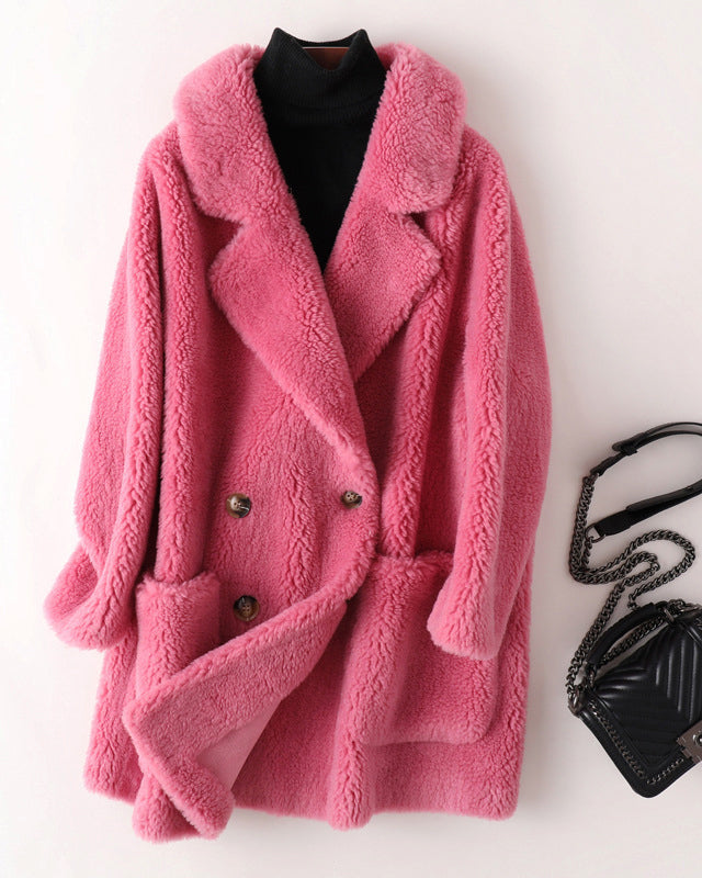 Lumina Wear Sofia oversized shearling winter coat with textured fabric and wide lapels, styled for a cozy, fashionable look.