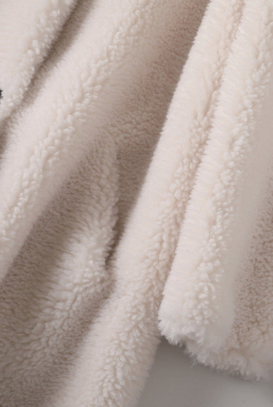 Luxurious plush oversized teddy coat for women with hood and large buttons by Lumina Wear, shown in a cozy, stylish fit.