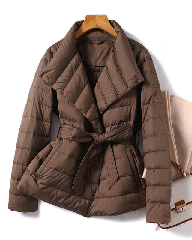 Lumina Wear Sofia quilted structured down jacket with tie belt, featuring a sleek design and warm insulated fill.