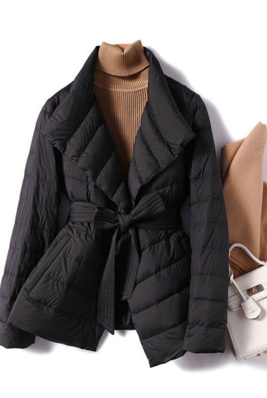 Lumina Wear Sofia quilted structured down jacket with tie belt, featuring a stylish and warm design.