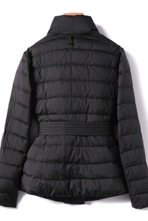 Lumina Wear Sofia quilted structured down jacket with tie belt, featuring a sleek design and padded insulation.