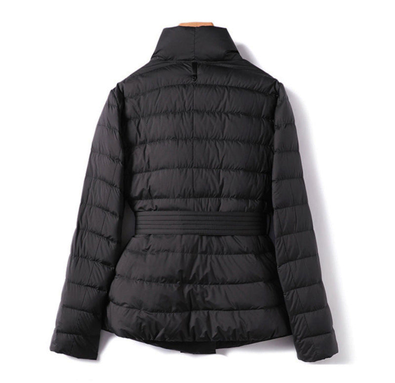 Lumina Wear Sofia quilted structured down jacket with tie belt, featuring a sleek design and padded insulation.