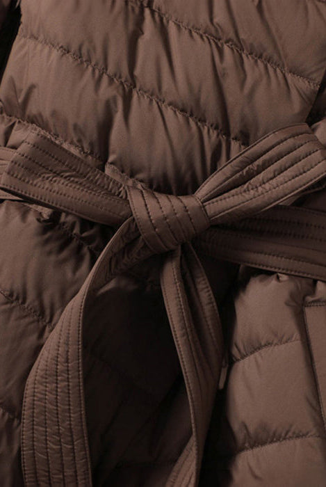 Lumina Wear Sofia quilted structured down jacket with tie belt, featuring a sleek design and warm insulation.