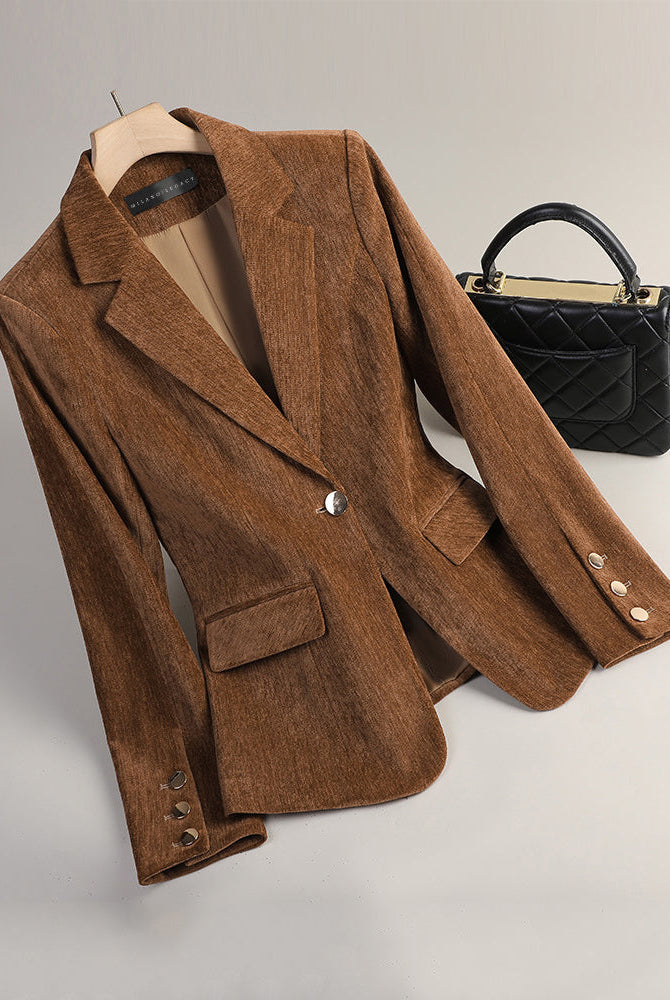 Slim tailored velvet blazer by Lumina Wear featuring radiant textured fabric, shown on a model in a stylish indoor setting.