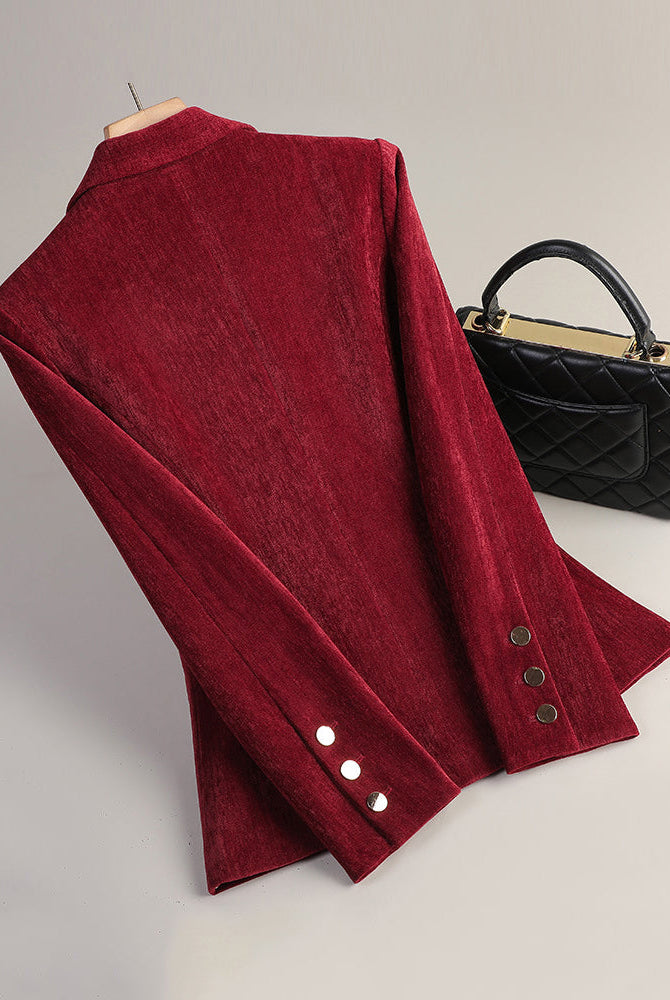 Sofia slim tailored velvet blazer with radiant texture from Lumina Wear, shown in a close-up of the dark, smooth fabric.