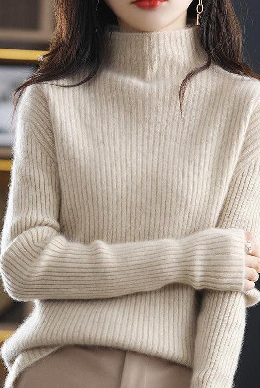 Lumina Wear Sofia striped oversized turtleneck sweater with a cozy fit, featuring bold horizontal stripes and a relaxed style.