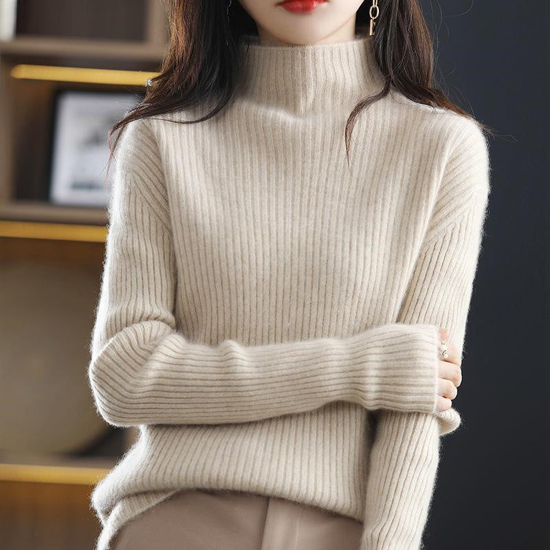 Gray and white striped oversized turtleneck sweater for women by Lumina Wear, casual and cozy, worn with jeans.