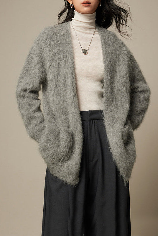Light blue Lumina Wear Sofia loose fit cardigan sweater with ultra-soft, breathable fabric and relaxed style, displayed on a hanger.
