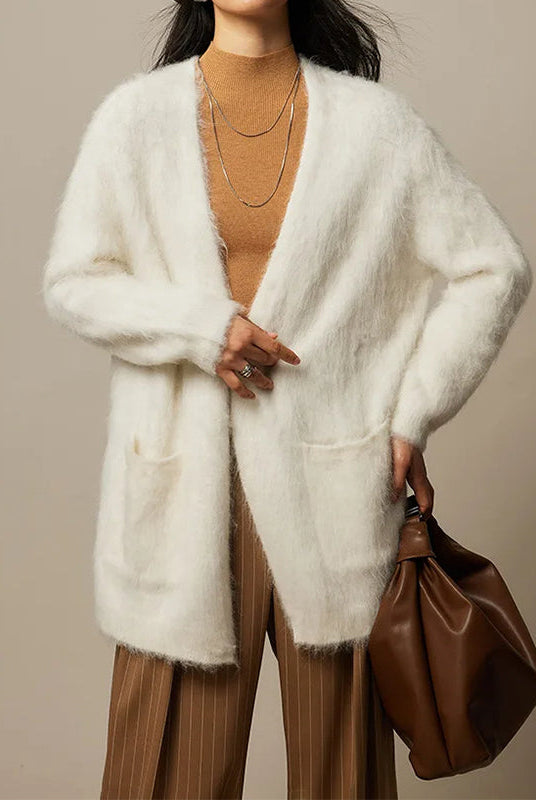 Light beige Lumina Wear Sofia loose fit cardigan sweater with ultra-soft, breathable fabric and relaxed style, displayed on a hanger.