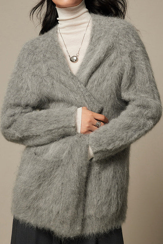 Light beige Lumina Wear Sofia ultra-soft breathable loose-fit cardigan sweater displayed on a hanger.