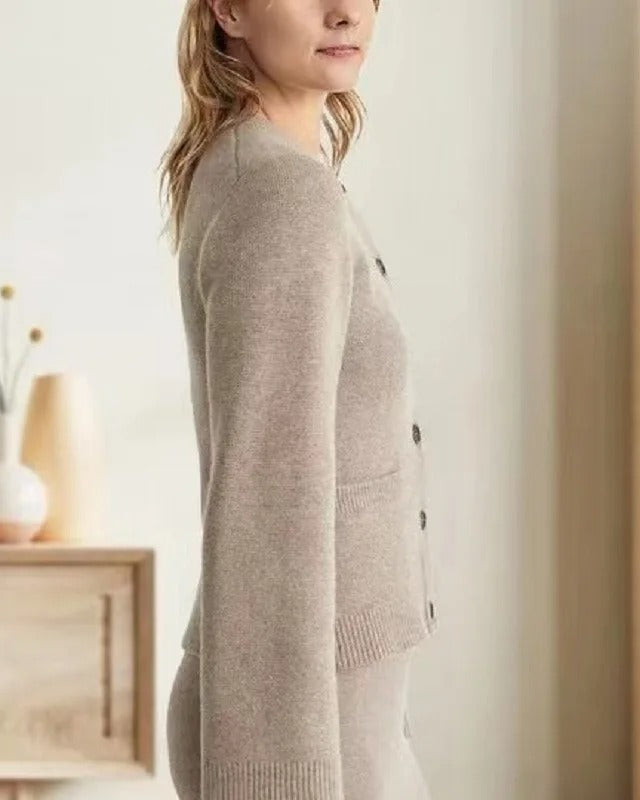 Vintage-inspired Lumina Sofia button cardigan with side pockets, featuring elegant design and soft knit fabric.