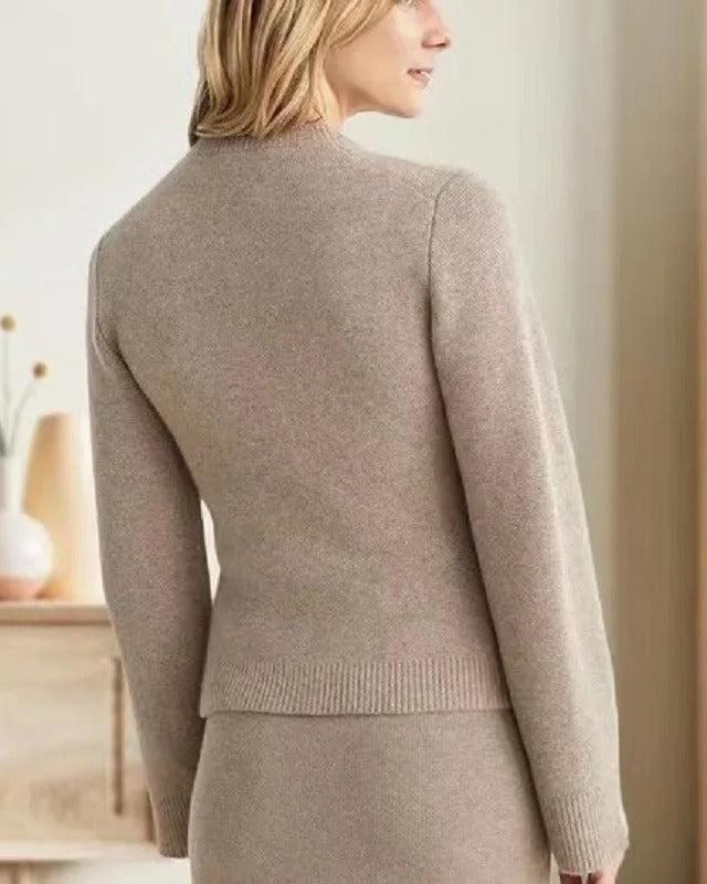 Vintage-inspired Lumina Wear Sofia cardigan with elegant buttons and side pockets, soft knit, in a classic design.
