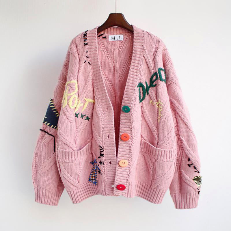 Valentina Lumina oversized patchwork knit cardigan with colorful button details, featuring a bold, cozy sweater design.