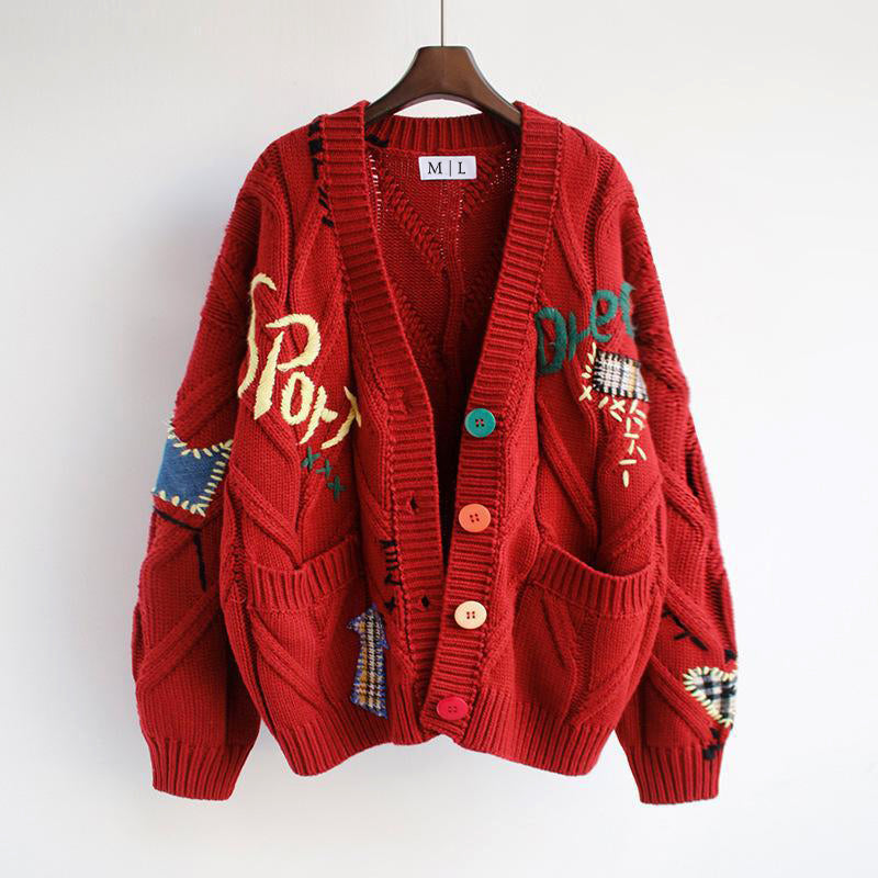 Valentina oversized knit cardigan by Lumina Wear featuring bold patchwork, colorful buttons, and a cozy, relaxed fit.