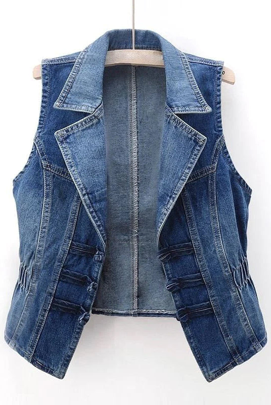 Celestial medium blue washed denim vest with toggle fastenings by Lumina Wear, featuring a stylish sleeveless design and front pockets.