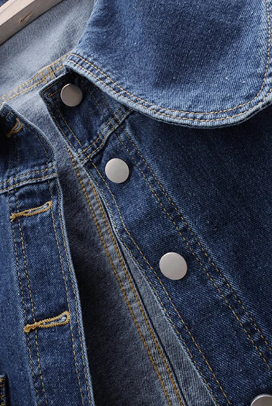 Light blue Valentina Lumina Wear classic fit denim jacket with button closure, shown on a model in a casual outdoor setting.