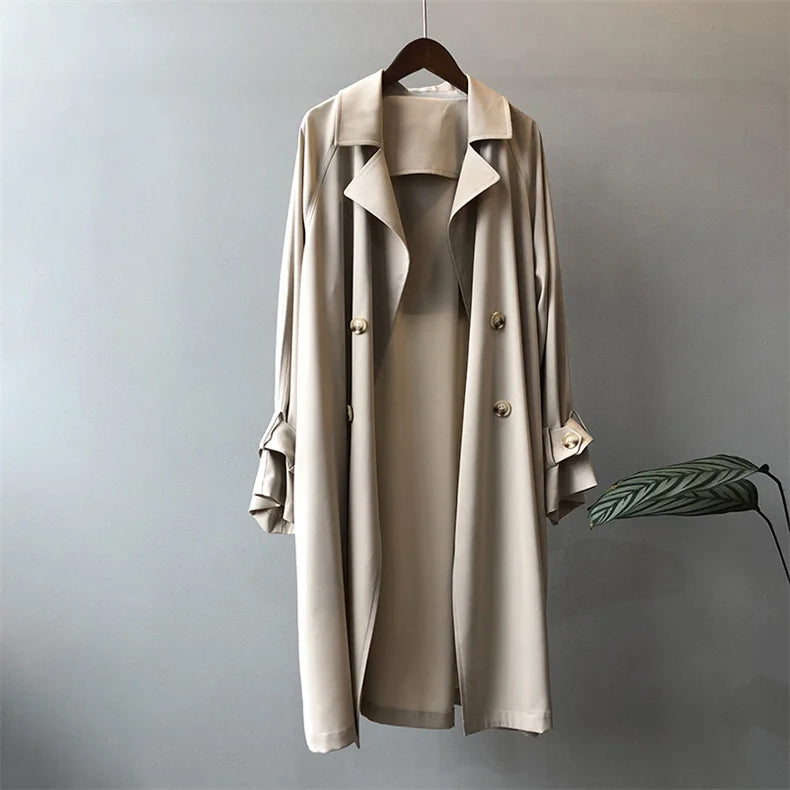 Elegant black trench coat for women by Lumina Wear, featuring classic closure and tailored fit.